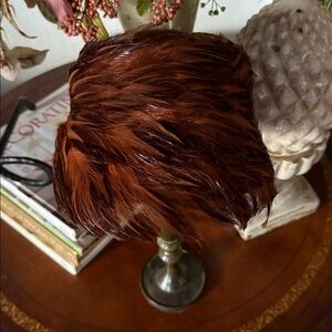 Vintage pheasant feather hat or fascinator from the mid-20th century.